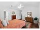 Cozy main bedroom with vaulted ceiling, hardwood floors, and two closets at 8676 Grassy Oak Trl, North Charleston, SC 29420