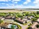 An aerial view displaying residential buildings complemented by a swimming pool and beautiful marsh view in the background at 870 Colony Dr # 14, Charleston, SC 29407