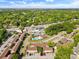 An aerial view showcases the community's residential buildings and community pool amid lush greenery and neighborhood streets at 870 Colony Dr # 14, Charleston, SC 29407
