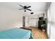 Spacious bedroom with hardwood floors, closet, ceiling fan, and chest at the foot of the bed at 870 Colony Dr # 14, Charleston, SC 29407