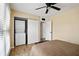 Bedroom featuring hardwood floors, a ceiling fan, and sliding closet doors at 870 Colony Dr # 14, Charleston, SC 29407