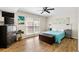 Bright bedroom with a ceiling fan, hardwood floors, and a chest at the foot of the bed at 870 Colony Dr # 14, Charleston, SC 29407