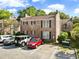 Two-story brick home showcasing manicured lawns and ample parking spaces at 870 Colony Dr # 14, Charleston, SC 29407