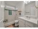 Clean bathroom with a sleek white vanity, modern fixtures, and a tiled walk-in shower at 928 Sycamore Ave, Charleston, SC 29407