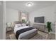 Inviting bedroom with a gray upholstered bed, modern furnishings, and neutral decor at 928 Sycamore Ave, Charleston, SC 29407