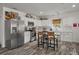 Modern kitchen featuring white cabinets, stainless steel appliances, and a stylish island with seating at 928 Sycamore Ave, Charleston, SC 29407