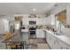 Well-equipped kitchen with stainless steel appliances, white cabinetry, and contemporary countertops at 928 Sycamore Ave, Charleston, SC 29407