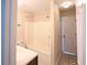 Bathroom featuring a vanity sink, shower-tub combo, and convenient door to outside at 9630 N Cardinal Dr, Ladson, SC 29456
