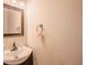 Bathroom featuring vanity sink, dark wood, and a bright lighted mirror at 9630 N Cardinal Dr, Ladson, SC 29456