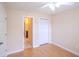 Bedroom featuring neutral walls, a ceiling fan, and an ensuite bathroom with a closet at 9630 N Cardinal Dr, Ladson, SC 29456