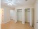 Spacious bedroom with natural light, two closets, neutral walls, and ceiling fan at 9630 N Cardinal Dr, Ladson, SC 29456
