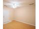 Living room featuring light beige walls, wooden floors, and bright ceiling fan at 9630 N Cardinal Dr, Ladson, SC 29456