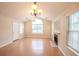 Bright living room with hardwood floors, a fireplace, and large windows for natural light at 9630 N Cardinal Dr, Ladson, SC 29456