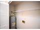 Utility room with water heater, shelving, and hook ups for washing machine at 9630 N Cardinal Dr, Ladson, SC 29456