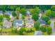 Aerial view features well-maintained homes with verdant treescapes and manicured lawns at 9636 Pebble Creek Blvd, Summerville, SC 29485