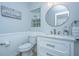 Well-lit bathroom features a vanity, modern fixtures, and a decorative mirror, offering style and functionality at 9636 Pebble Creek Blvd, Summerville, SC 29485