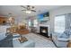 Spacious living room open to the kitchen, featuring a fireplace and a comfortable seating area at 9636 Pebble Creek Blvd, Summerville, SC 29485