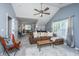 Open living room boasts vaulted ceilings, fan, and comfortable seating, great for entertaining at 9636 Pebble Creek Blvd, Summerville, SC 29485
