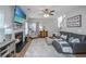 Cozy living room with a fireplace, plush seating, and ample natural light at 9636 Pebble Creek Blvd, Summerville, SC 29485