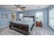 Spacious main bedroom features a ceiling fan, multiple windows, and comfortable furnishings, ensuring relaxation at 9636 Pebble Creek Blvd, Summerville, SC 29485