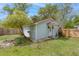 Backyard featuring a small cottage with inviting porch, yard, and natural stream at 9666 Jamison Rd, Ladson, SC 29456