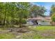 A well-maintained backyard featuring a fire pit and garden boxes at 9666 Jamison Rd, Ladson, SC 29456