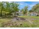 An expansive backyard featuring a fire pit and garden boxes at 9666 Jamison Rd, Ladson, SC 29456