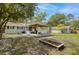 A backyard with a wooden deck, garden box, and a well-maintained lawn at 9666 Jamison Rd, Ladson, SC 29456