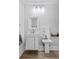 Modern bathroom design features white vanity, mirror, lighting, and a bidet at 9666 Jamison Rd, Ladson, SC 29456