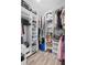 Organized walk-in closet with built-in shelving and ample storage for clothing and accessories at 9666 Jamison Rd, Ladson, SC 29456