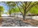 Charming home with a white picket fence, mature trees, and a detached garage at 9666 Jamison Rd, Ladson, SC 29456