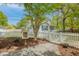 Charming home with a white picket fence, lush landscaping, and a Little Free Library at 9666 Jamison Rd, Ladson, SC 29456