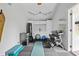 Well-equipped home gym with weights, punching bag, fridge, and rubber flooring at 9666 Jamison Rd, Ladson, SC 29456
