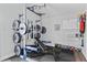 Home gym featuring weight rack, bench, kettlebells, and mirror for training at 9666 Jamison Rd, Ladson, SC 29456