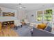 Cozy living room with seating area featuring bright natural light and hardwood floors under a stylish ceiling at 9666 Jamison Rd, Ladson, SC 29456