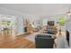 Spacious living room with hardwood floors, a gray sofa, and a fireplace at 9666 Jamison Rd, Ladson, SC 29456
