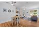 Open concept living room and dining area with lots of natural light at 9666 Jamison Rd, Ladson, SC 29456