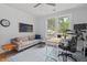Inviting home office with comfortable seating, natural light, and functional workspace featuring hardwood floors at 9666 Jamison Rd, Ladson, SC 29456