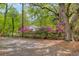 Pink Azalea bushes along the fence line of a charming yard at 9666 Jamison Rd, Ladson, SC 29456