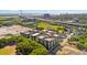 Aerial view showcases urban community with highway, river, and cityscape against a bright sky at 1 Cool Blow St # 344, Charleston, SC 29403