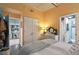 Bedroom featuring yellow walls and an open view to a dining area at 1 Cool Blow St # 344, Charleston, SC 29403