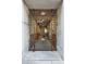 Secured entry with a decorative iron gate leading into the building's hallway, enhancing safety and architectural detail at 1 Cool Blow St # 344, Charleston, SC 29403