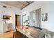 Bright dining area featuring a rustic wood table, bench, and a view of an open doorway at 1 Cool Blow St # 344, Charleston, SC 29403