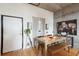 Dining area featuring hardwood floors, modern decor, and a rustic wood table with bench seating at 1 Cool Blow St # 344, Charleston, SC 29403