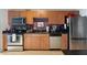 Well-equipped kitchen featuring stainless steel appliances, wooden cabinetry, and granite countertops at 1 Cool Blow St # 344, Charleston, SC 29403