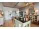 Open living space featuring concrete ceiling, hardwood floors, and a light-colored island at 1 Cool Blow St # 344, Charleston, SC 29403