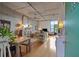 Modern living room with open floor plan, wood floors, concrete ceiling, island and industrial-chic decor at 1 Cool Blow St # 344, Charleston, SC 29403