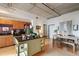 Modern living space with open kitchen, wood floors, a dining area and plenty of natural light at 1 Cool Blow St # 344, Charleston, SC 29403