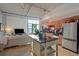 Spacious living area features an open floor plan with an island and stainless steel appliances in the kitchen at 1 Cool Blow St # 344, Charleston, SC 29403