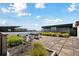 Large rooftop patio with patio table and lush greenery surrounding the area at 1 Cool Blow St # 344, Charleston, SC 29403